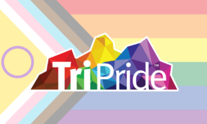 TriPride logo in front of ace progress pride flag
